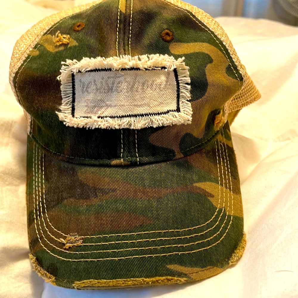 Camouflage cap with resisterhood label